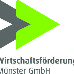 Logo der Wirtschaftsförderung Münster GmbH mit grüner und grauer Pfeilgrafik.